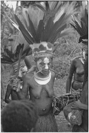 Bride price ritual: bride, with headdress and shell valuables