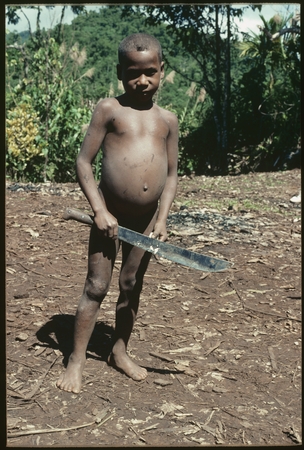 Young boy with bushknife.