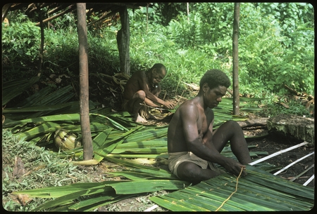 Men weaving leaves.