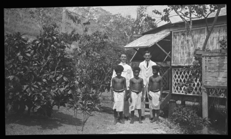 Mining company manager, E. Hogan Taylor and solicitor, Robert Dugald Bertie with three Papua New Guinean boys, probably in...