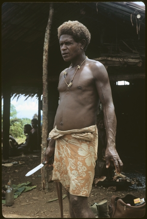 Portrait of man holding knife.