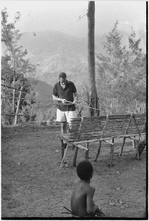 Unidentified white man practicing archery near Cooks&#39; house in Kwiop