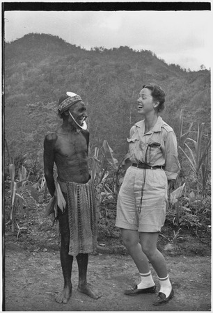 Anthropologist Denise O&#39;Brien laughs with man wearing large kina shell jewelry