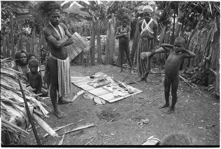 Pig festival, pig sacrifice, Tsembaga: ritual exchange of shell valuables, steel axes, pork and other wealth displayed on mat