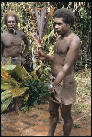 Maenaa&#39;adi with plants for ritual. His older brother Dangeabe&#39;u is behind him.