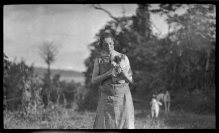European woman holding puppy