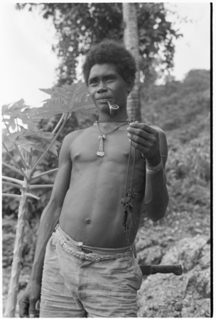 Laete&#39;eboo the priest, holding object that is probably matala ancestral relic he is going to use in the ritual.