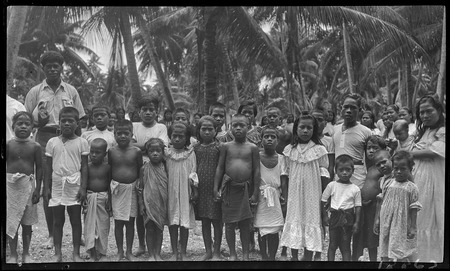 Kiribati children at a hookworm lecture, Fijian presenter on left