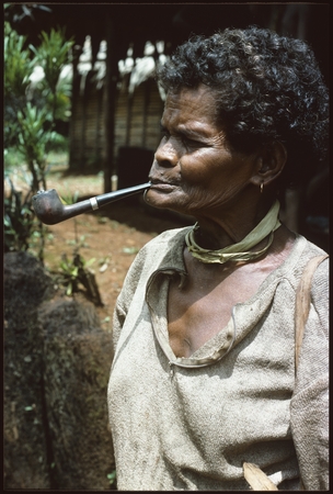 Woman with long pipe.