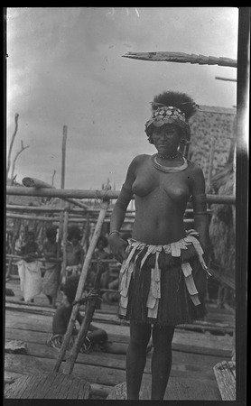 Adamase, a Motu woman of Gaile village wearing head piece, and kina, a crescent shell valuable necklace