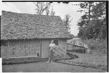 Edwin Cook&#39;s house in Kwiop: wife Nancy Cook, rainwater capture system on right