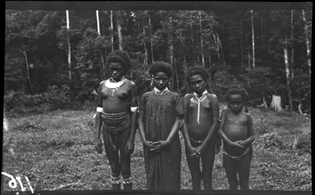 Young Mafulu girls with shell jewelry; on the left is a kina, a crescent shaped shell valuable
