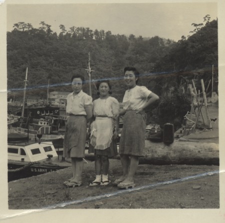 Women posing during Claude M. Adams visit to a Japanese fishing village and fish processing plant. Japan, c1947. Adams wor...