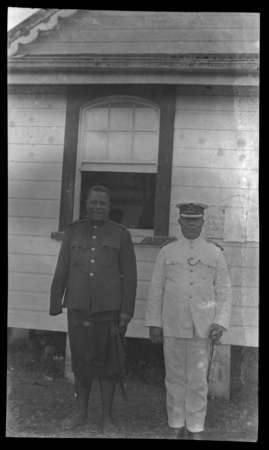 Portrait of two men dressed in uniform