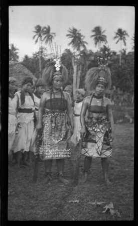 Group of women, the two in front wearing traditional Samoan clothing and headdress