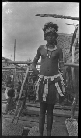 Adamase, a Motu woman of Gaile village, wearing crescent kina shell valuable necklace, jewelry, and head piece