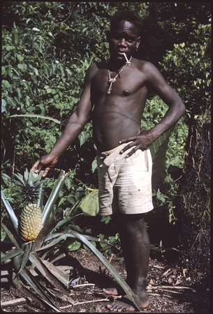 Young man (Seda?) with pineapple.
