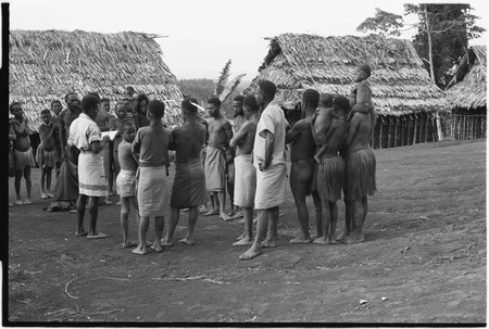Koguman: man with paper, taking census of gathered people
