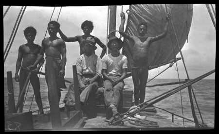 Men on sailboat, Bomatu Point, Kiriwina