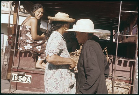 Papeete, Tahiti: passengers in the back of a truck