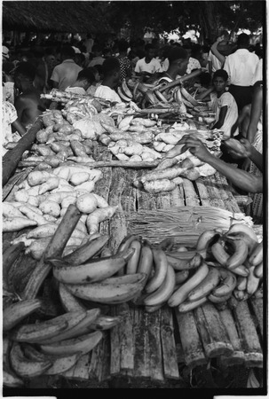 Madang market: bananas, yams, and other produce on tables
