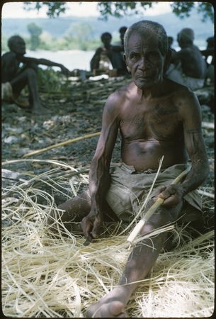 Man with fibers, probably Laulasi, Langalanga, Malaita.