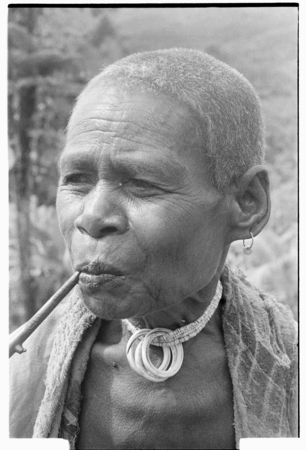 Older woman with tale&#39;ekome necklace.