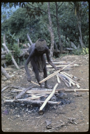 Food preparation: Moramp, a Maring woman, preparing fire