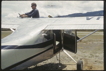 Mount Hagen airstrip, pilot Peter Hurst refueling