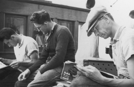 [K.O. Emery, Herbert Mann and Francis Parker Shepard reading aboard R/V E.W. Scripps]