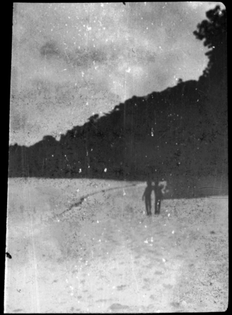 Two people at the shore, possibly children