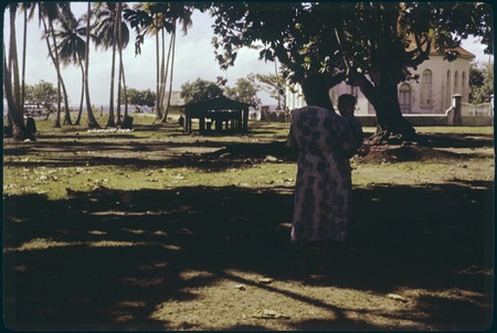 Protestant church from Te Awa Awa, Moorea, woman and child in foreground