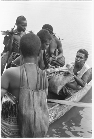 Trading with saltwater (coastal) women in the canoes.