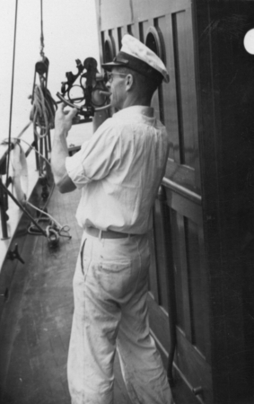 [Unidentified man shooting the sun with a sextant aboard R/V E.W. Scripps]