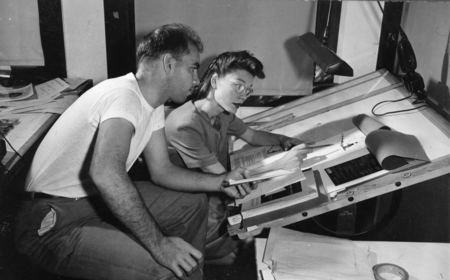 Sam Hinton and unidentified woman at drafting table in the University of California Division of War Research (UCDWR) Train...