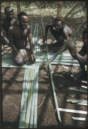 House-building: Kwiop men weave wall panels for the Cooks&#39; house