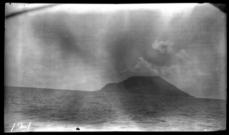 Distant view of Tinacula, an active volcano island near Santa Cruz