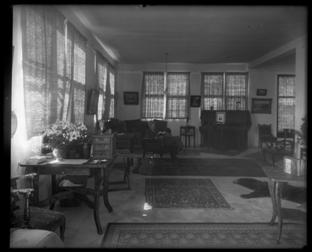 William Emerson Ritter sitting and reading in his apartment, which was the (top) second floor of the George H. Scripps Mem...