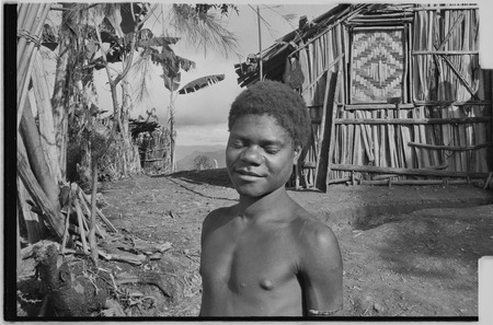 Adolescent boy in front of the Rappaports&#39; house