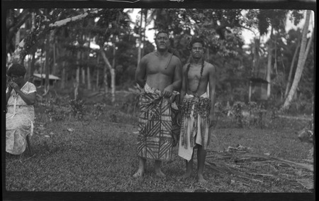 Portrait of two men wearing traditional Samoan skirts