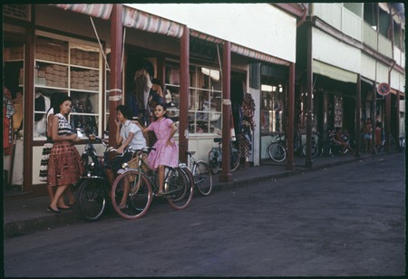 Papeete, Tahiti: street scene, girls on bicycles