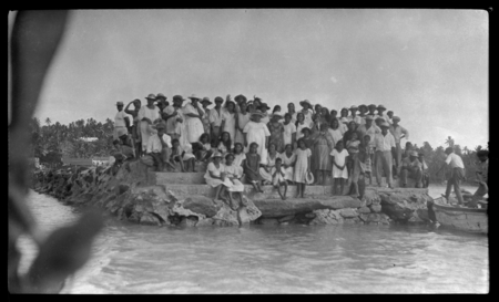 Cook Islanders on stone wharf