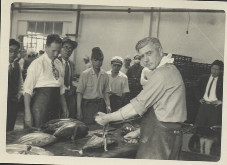 Claude M. Adams (R) during a visit to a Japanese fishing village and fish processing plant. Japan, c1947