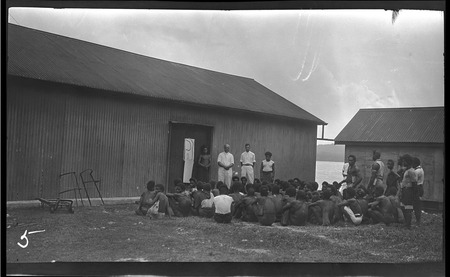 Hookworm lecture outside buildings at Rabaul, New Britain