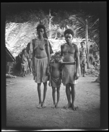 Woman, man, and child, probably in Vanuatu