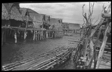 Houses on stilts over water in a Motu village