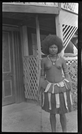 Taumauoka, a Motu woman, in front of Western style building