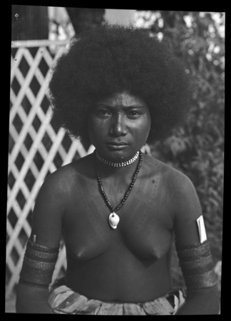 Portrait of Taumanoka, a Motu woman, wearing jewelry and armbands