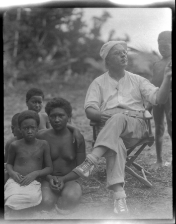 Sylvester Lambert sitting with woman and children
