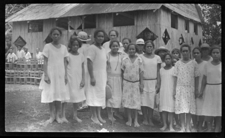 Cook Islands girls with large building in background